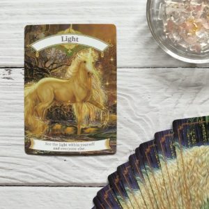 a magical unicorn oracle card