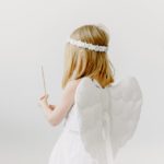 side view shot of a girl in angel costume