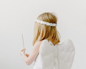 side view shot of a girl in angel costume
